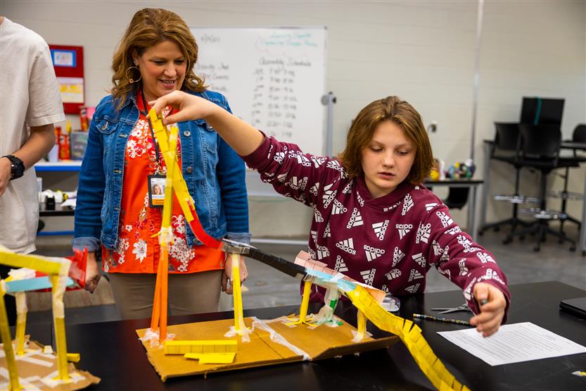 Students build paper rollercoasters